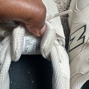 New Balance Women's Sneakers in Off-White with Black Logo